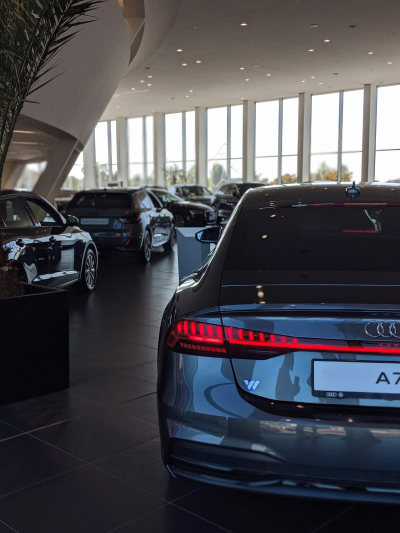 gray car parked in dealership lobby